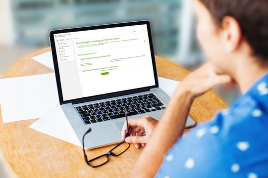 Woman sitting in front of her laptop